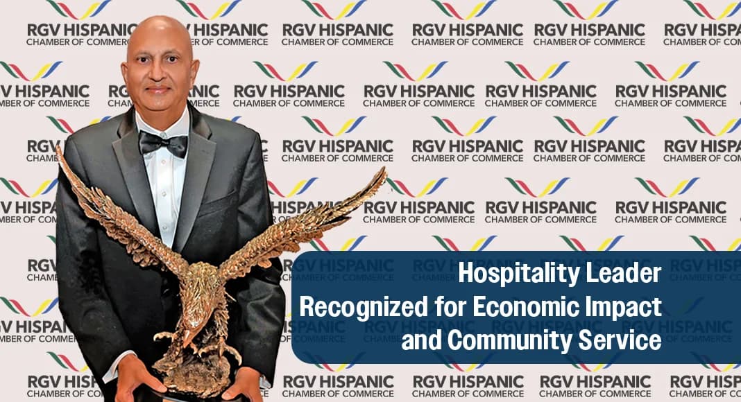 Barry Patel in a tuxedo holding the Golden Eagle award in front of an RGV Hispanic Chamber of Commerce backdrop
